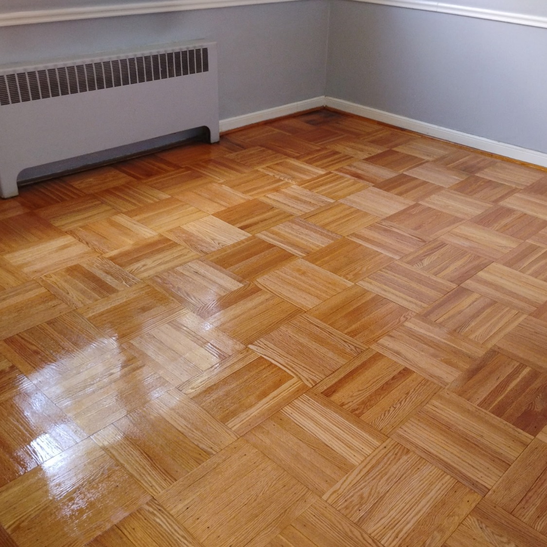 After: Floor Refinishing Project - Scratched and worn floors restored to like-new condition